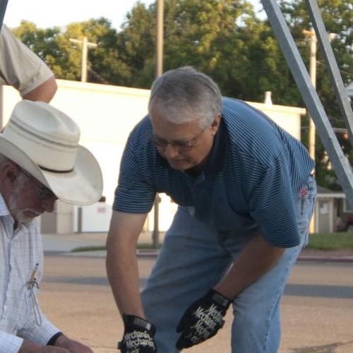 team putting together windmill