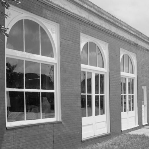 SOUTH FRONT OF FACTORY BUILDING ON CENTRAL AVENUE, LOOKING NORTHEAST, SHOWING WINDOWS, THREE ENTRANCE DOORS, 